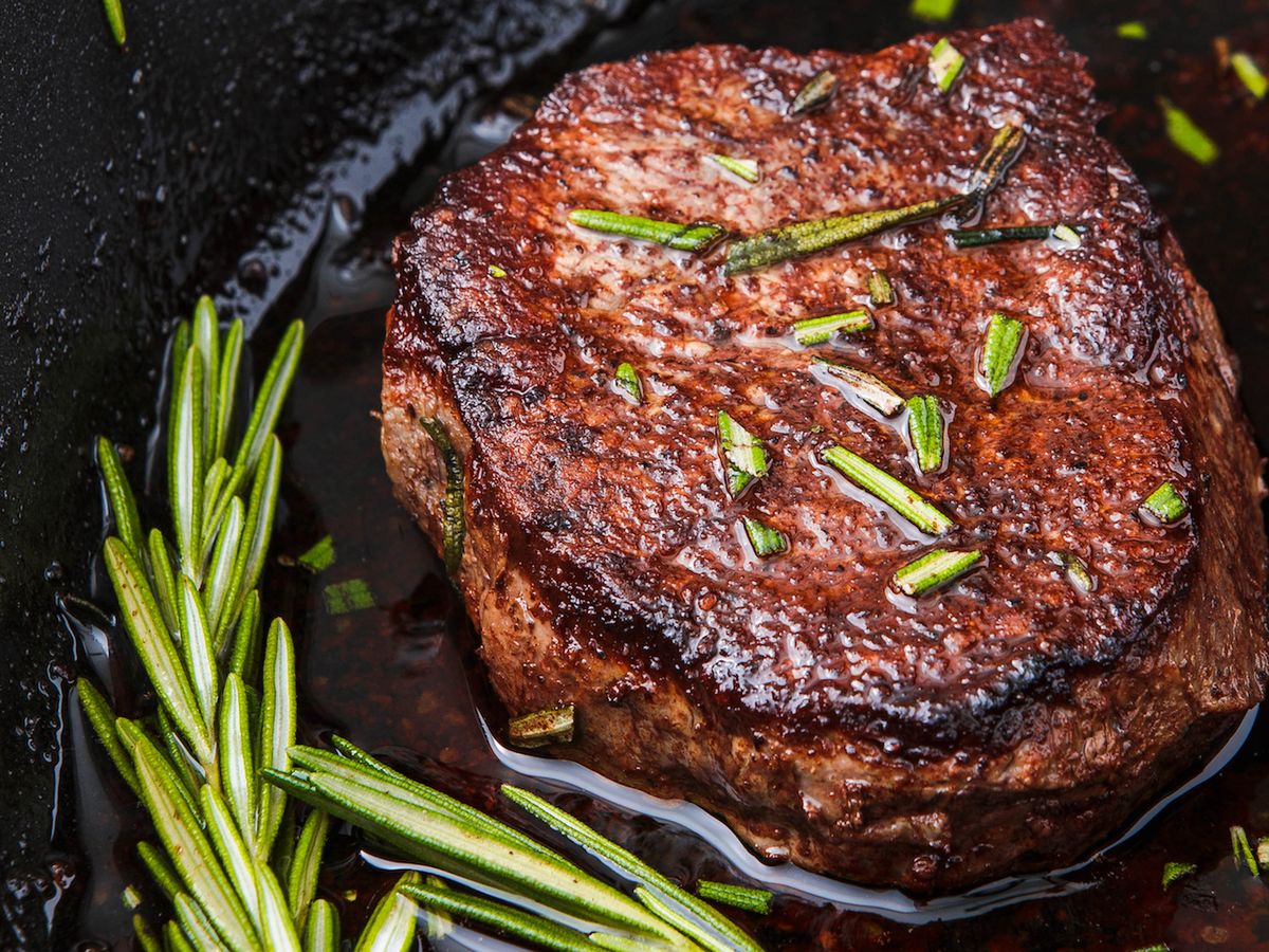 steak in a pan with butter